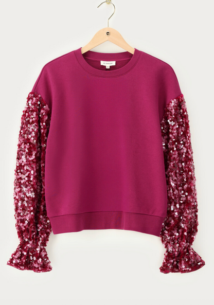 Paarse sweater met pailletten mouwen